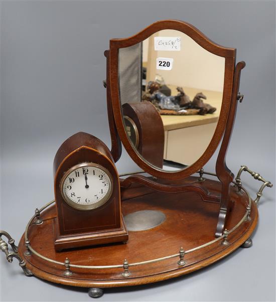 An oval tray, a shield shaped toilet mirror and an oval mantel clock